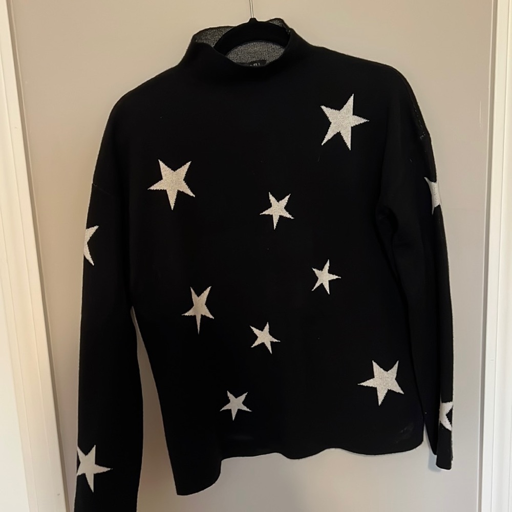 Black mock neck sweater with white stars